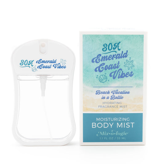 A white spray bottle of Mixologie's 30A Emerald Coast Vibes Moisturizing Body Mist (1.1 fl oz/35 ml) sits next to its beach-themed teal and cream box. This alcohol-free perfume delivers a “Beach Vacation in a Bottle” fragrance.