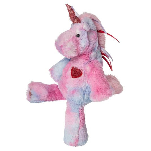 The Mary Meyer Marshmallow Junior Adora Unicorn is a plush toy with pink, blue, and purple fur, a sparkly pink horn, red heart patch, and red ribbons. Soft and kid-friendly, it stands upright with one leg raised.