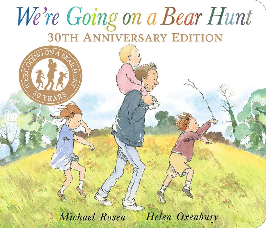 A man carries a child on his shoulders while three other children walk and run through the grass. The cover features We&