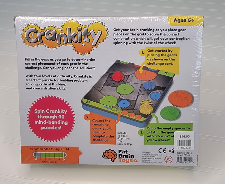 The back of the Crankity Gear Toy box by Fat Brain Toys features colorful gears, components, instructions, and age details (6+), encouraging independent play—ideal as a travel toy with its tagline and company logo displayed.