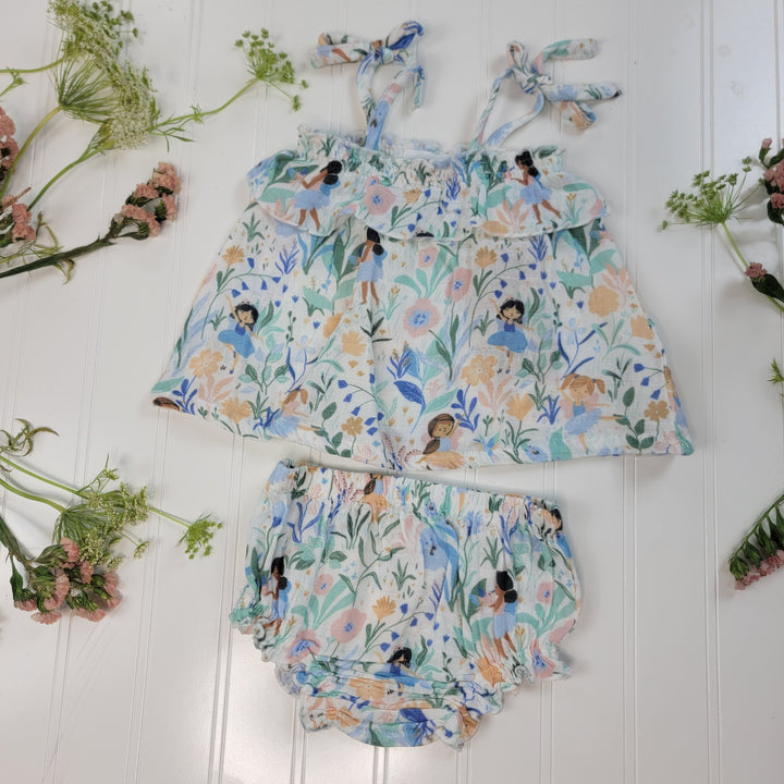 The Angel Dear Summer Baby Clothes set features a sleeveless top with shoulder ties and matching bloomers in a floral pattern, displayed flat on a white surface with pink and green flowers and greenery.