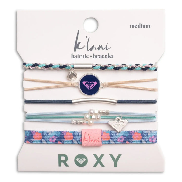 Five coastal-inspired K'lani x Roxy Ocean Bloom hair tie bracelets are shown on a branded card. In medium size, they feature braids, beads, a heart charm, and floral patterns. From K'lani hair tie bracelets.