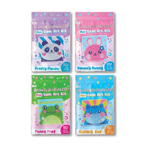 Four OOLY Mini Razzle Dazzle Test and Try Assortment 2 packs are shown, each with a different animal—Pretty Panda, Bouncy Bunny, Funny Frog, or Cutesy Cat. Each includes a small canvas and gem art tools.