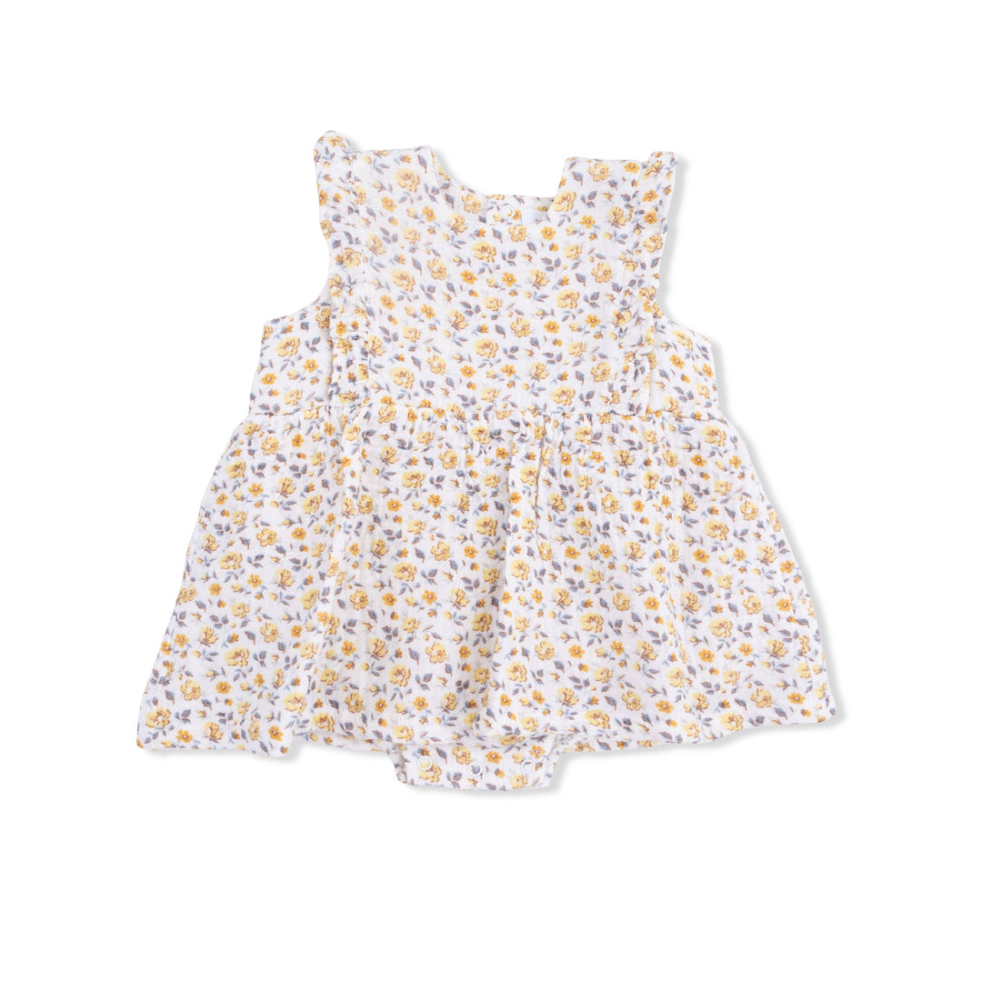 The Yellow Country Roses - Ruffle Bubble Dress by Angel Dear is a white sleeveless dress in organic cotton muslin, with a flared skirt and small yellow and purple flower print, shown on a plain white background.