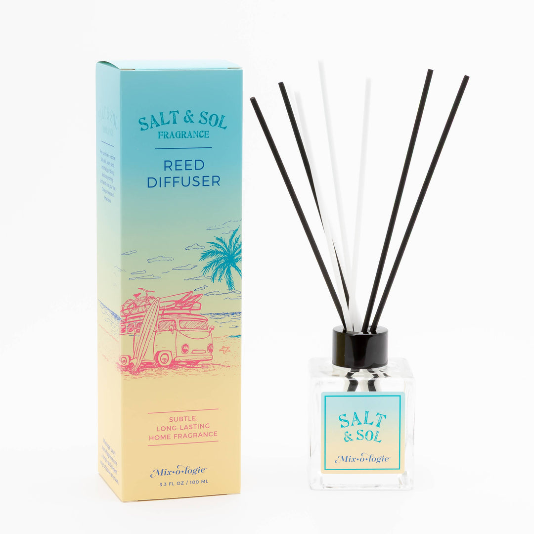 The Mixologie Salt & Sol Reed Diffuser comes in a decorative beach-themed box. Housed in a clear glass bottle with a blue label, it features black and white reeds to provide long-lasting, flameless fragrance for your home.