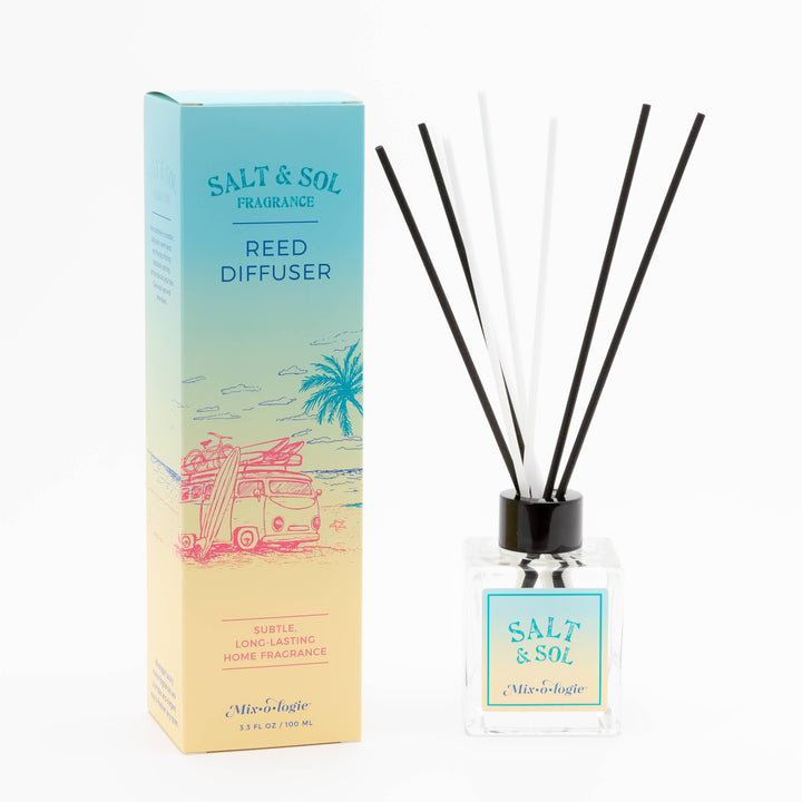 The Mixologie Salt & Sol Reed Diffuser comes in a decorative beach-themed box. Housed in a clear glass bottle with a blue label, it features black and white reeds to provide long-lasting, flameless fragrance for your home.