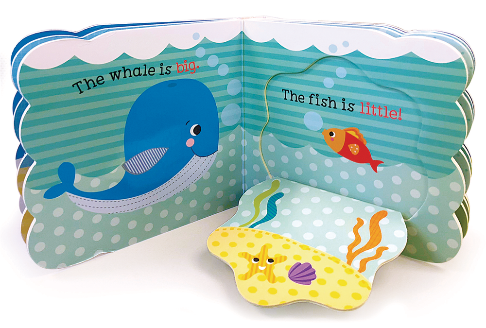 The Babies Love Opposites Lift-a-Flap Board Book by Cottage Door Press features a smiling blue whale labeled "The whale is big" and a small orange fish labeled "The fish is little," with a yellow sea floor for sensory fun.