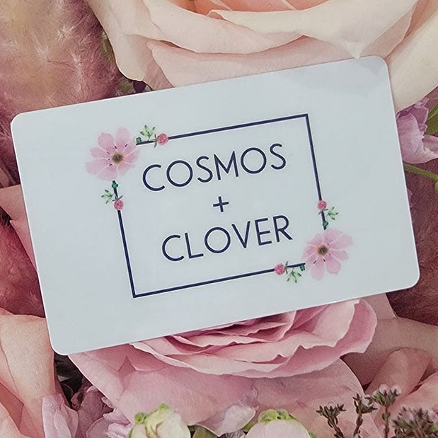 A Cosmos + Clover Boutique Gift Card, adorned with pink floral accents and set on pastel pink roses, makes the perfect gift in Jackson, MN.