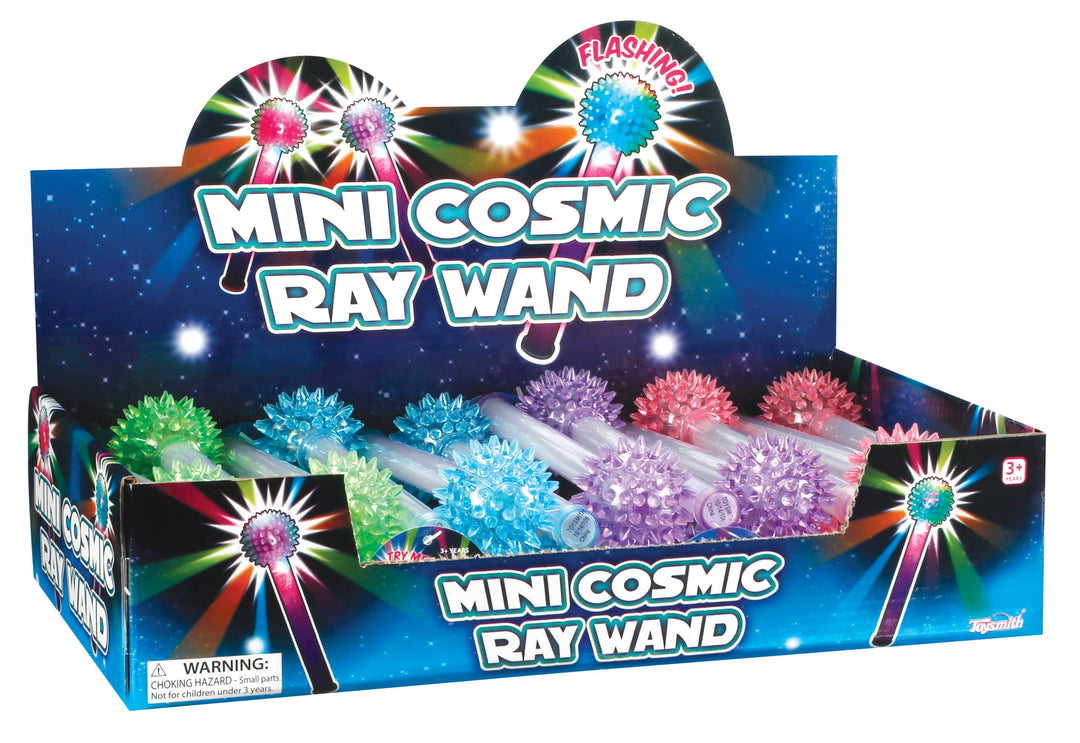 A Toysmith Mini 7" Cosmic Ray Wand display box features light-up, soft glow wands in blue, pink, and purple with a starry backdrop—colorful, tactile party favor toys perfect for dazzling fun.