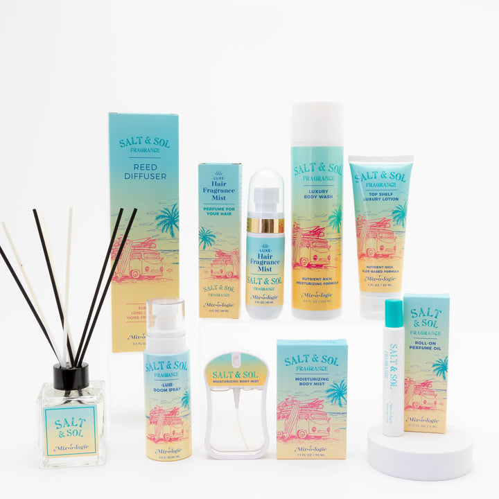 A selection of Mixologie Salt & Sol skincare and fragrance items, featuring bottles, tubes, sprays, and the Salt & Sol Reed Diffuser—all in turquoise and yellow beach-themed packaging on a white surface.