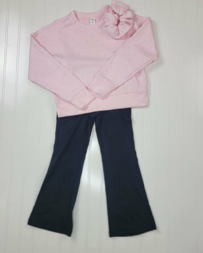 A light pink Little Girls Sophia Rhinestone Pullover Flare Pant and Scrunchie Set by 90 Degree by Reflex, featuring a long-sleeved rhinestone pullover, a matching scrunchie, and black flare pants.